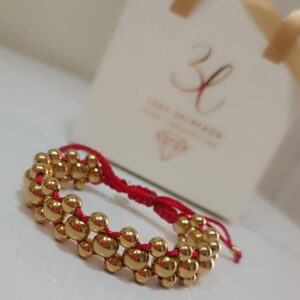 Pulsera unisex con balines  laminado en oro 18k